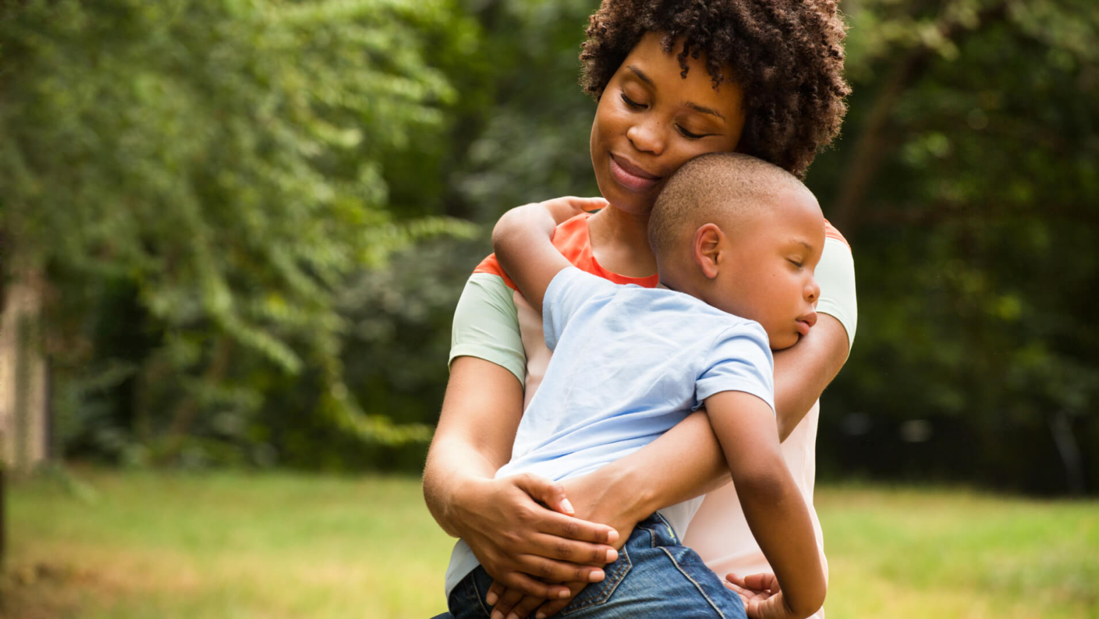 A woman holding a child