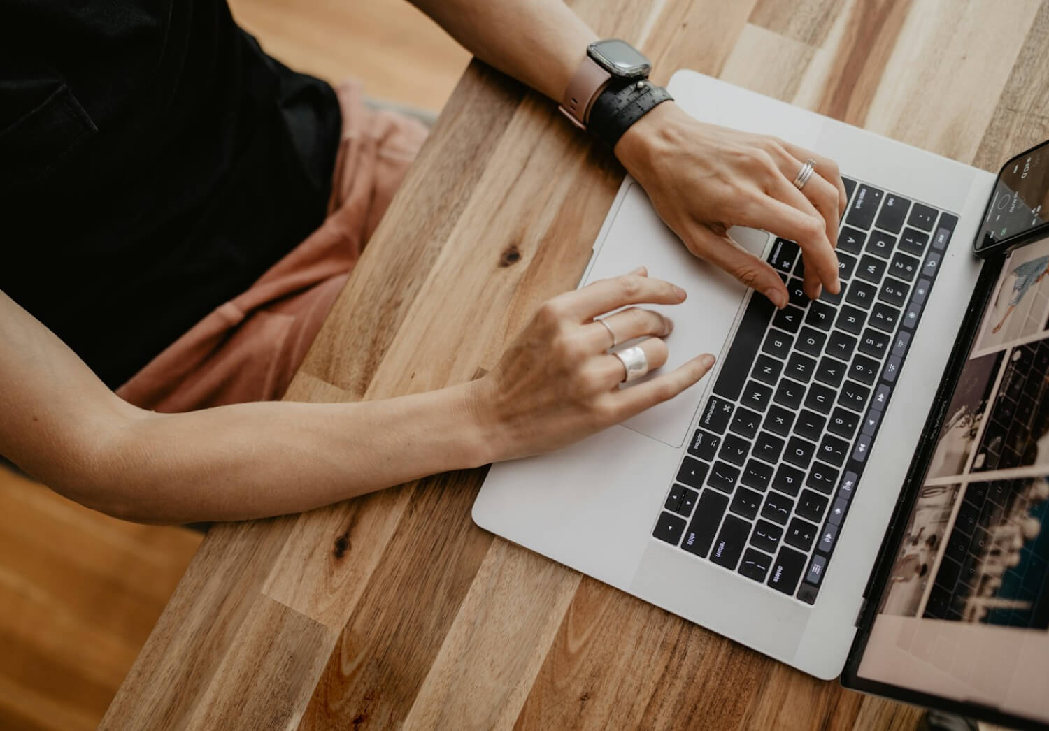 A person typing on a laptop