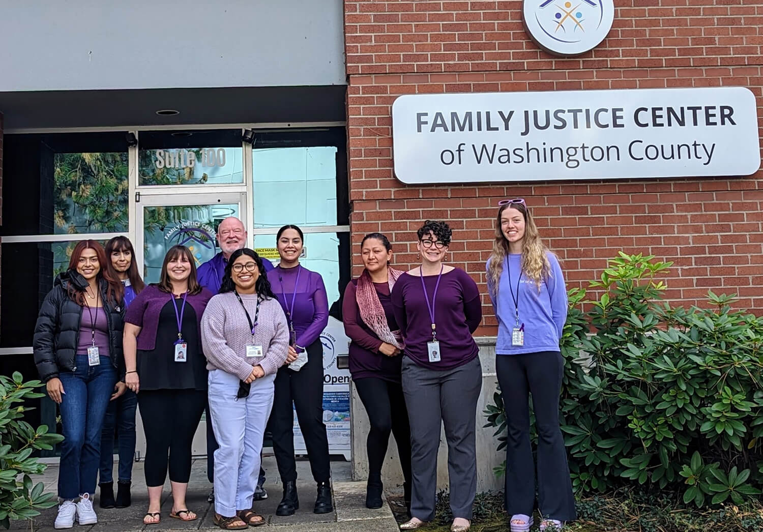 A group of people in front of family justice center of washington county.