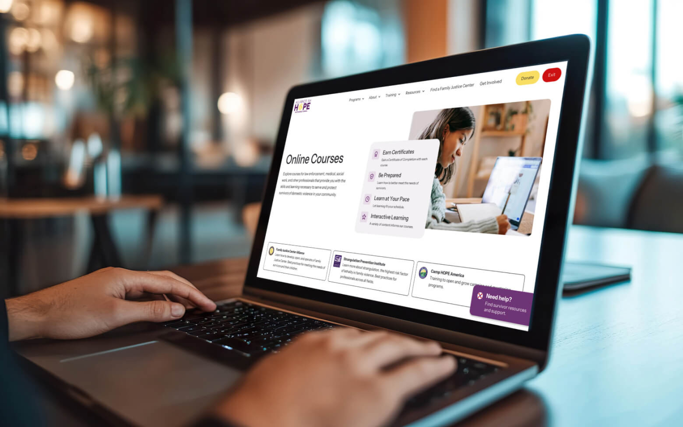 A laptop being used with the Alliance for HOPE online courses page being displayed on it