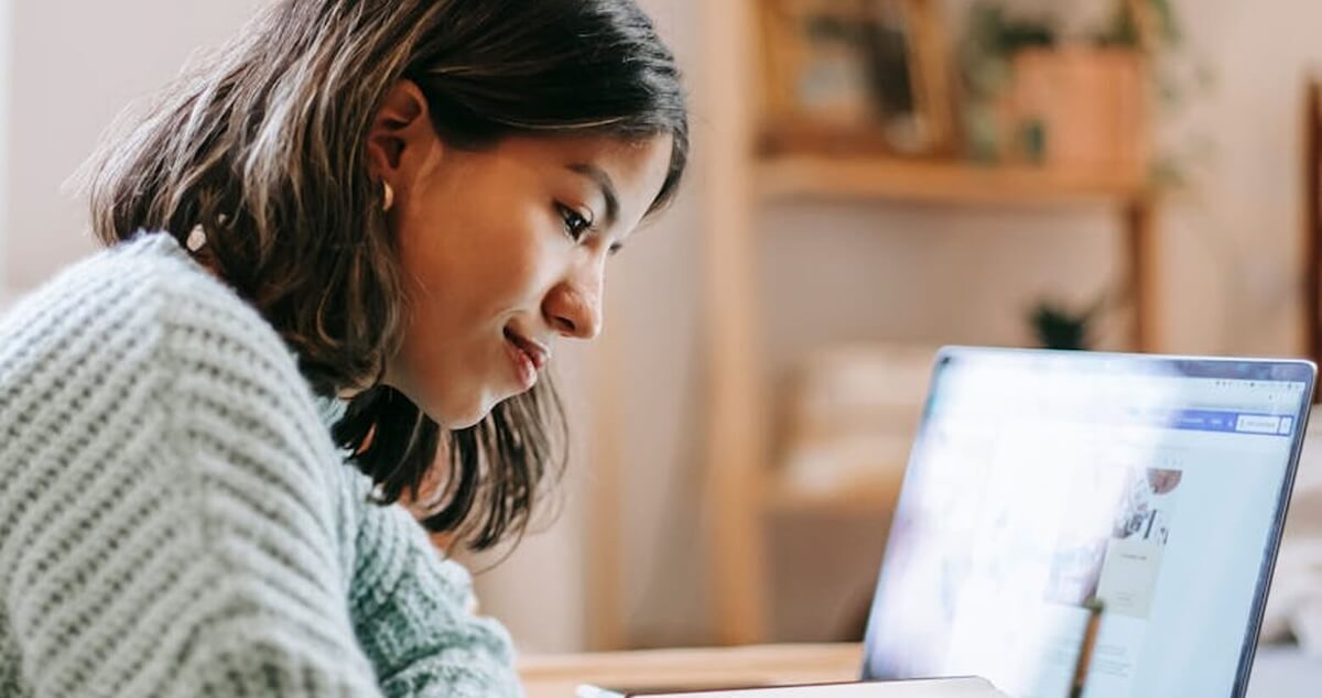 A person watching a webinar on a laptop