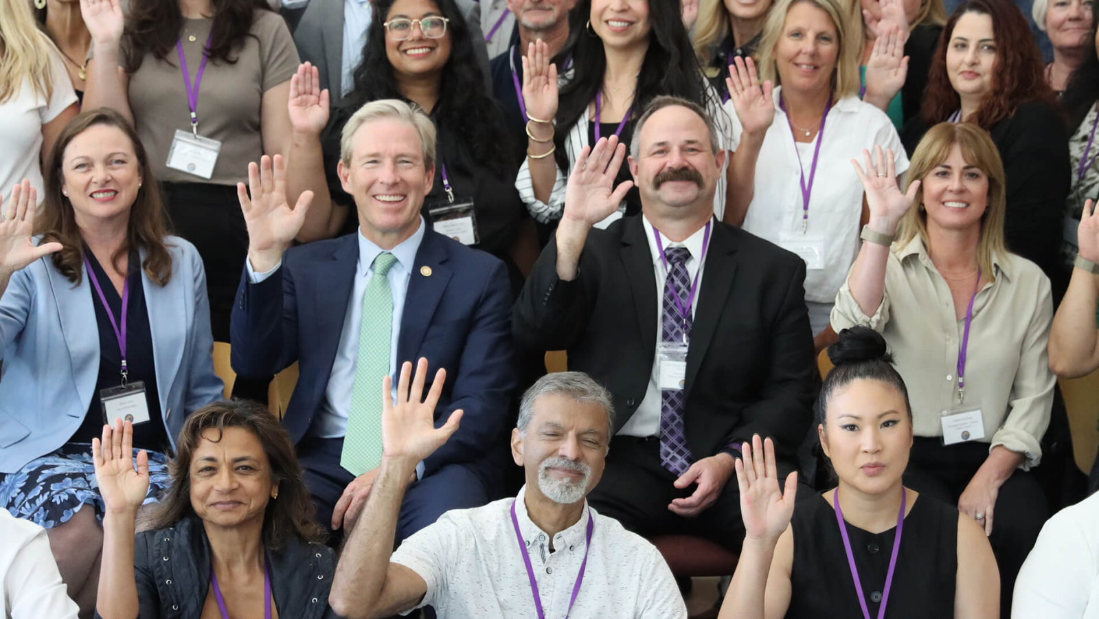 A group of people raising their hands